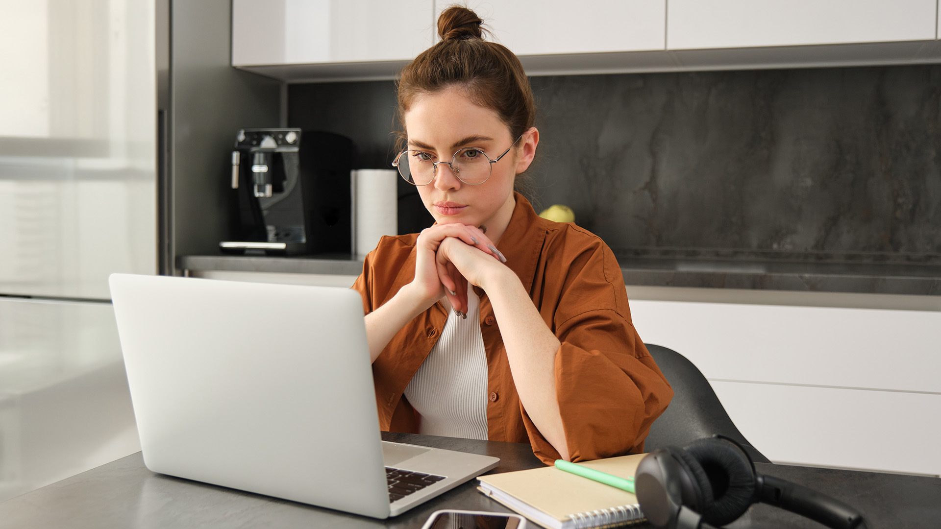 Marketing professional planning promotional gifts campaigns and strategic content in a modern office environment.