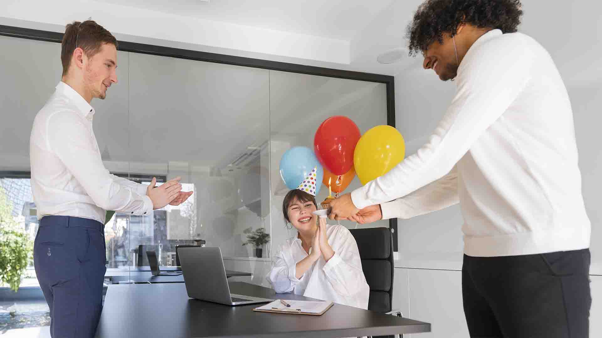 Employees celebrating with personalized promotional gifts, reinforcing brand presence and motivation in the office.